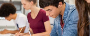 stock image of students writing